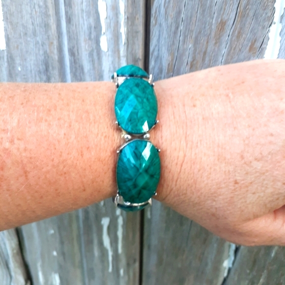 Turquoise stone stretch bracelet with silver accents.  Macy's brand jewelry - Picture 2 of 3